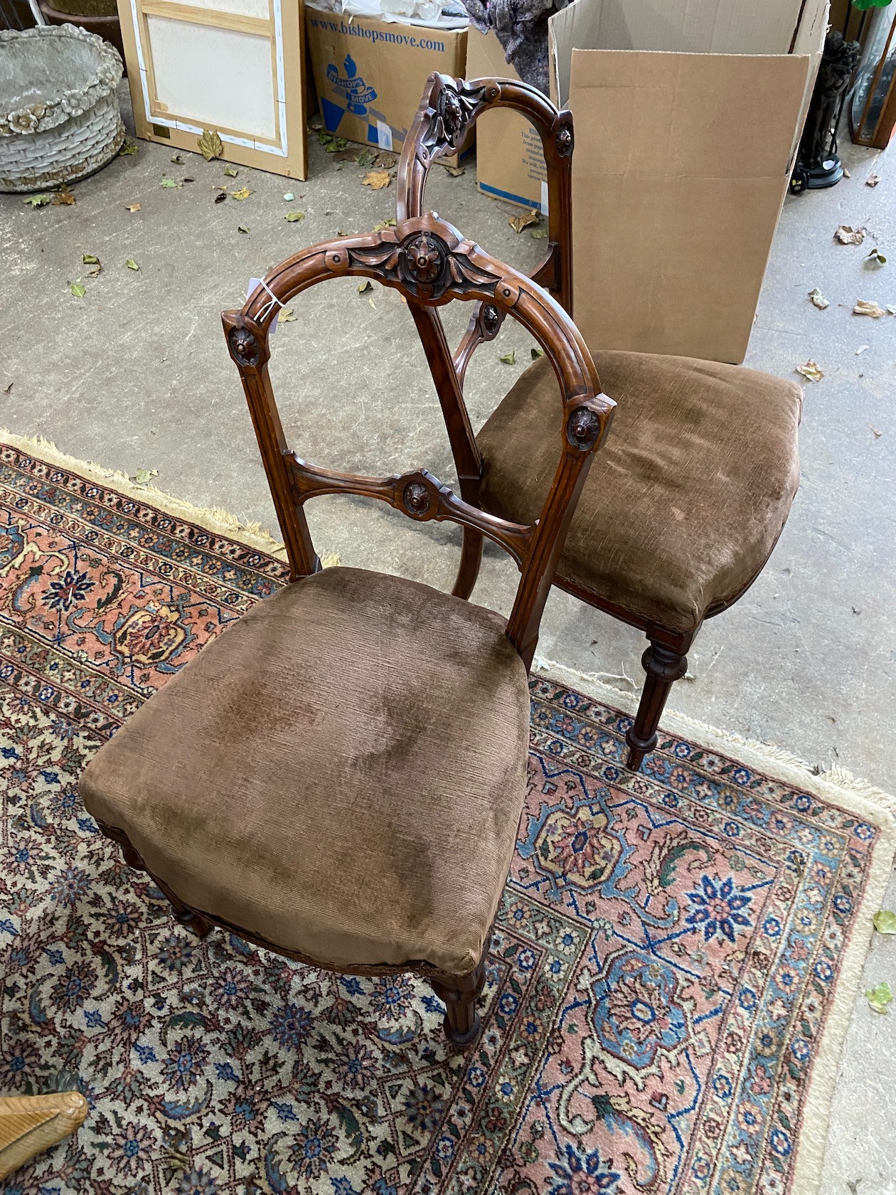 A set of four Victorian walnut dining chairs